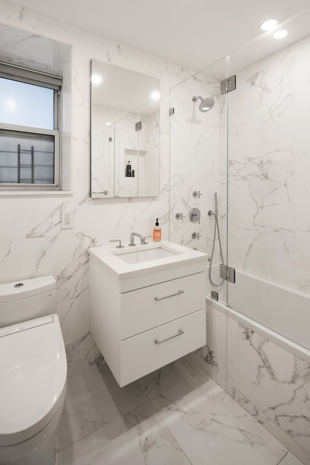 full bathroom featuring tile patterned flooring, tile walls, and toilet