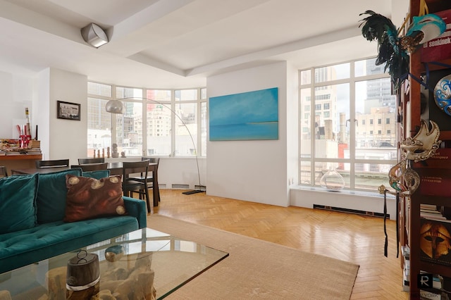 living room featuring plenty of natural light and light parquet floors