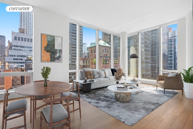 living room featuring hardwood / wood-style floors and expansive windows