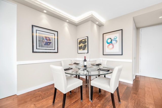 dining space featuring wood-type flooring