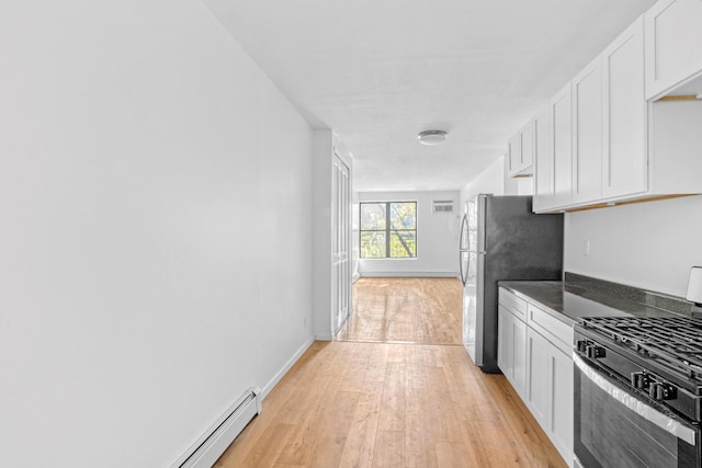 kitchen featuring light hardwood / wood-style floors, baseboard heating, white cabinets, and stainless steel appliances