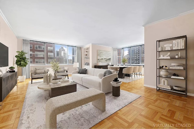 living room with crown molding, floor to ceiling windows, and light parquet floors