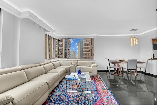 living room with dark tile patterned flooring, an inviting chandelier, and ornamental molding