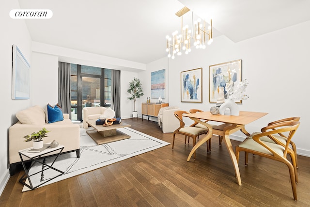 dining space featuring an inviting chandelier and hardwood / wood-style flooring