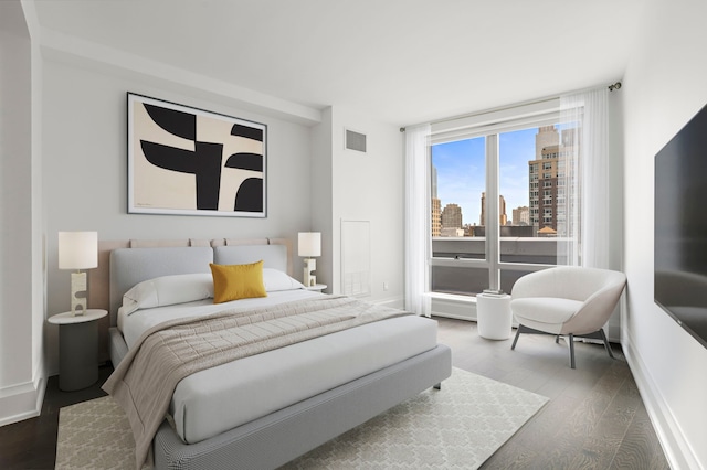 bedroom with hardwood / wood-style floors