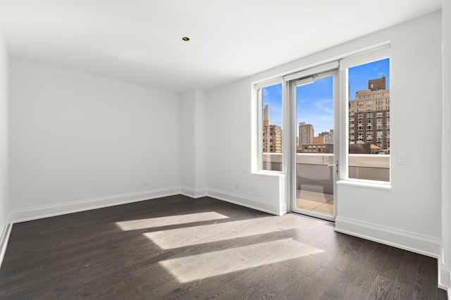 spare room featuring hardwood / wood-style floors