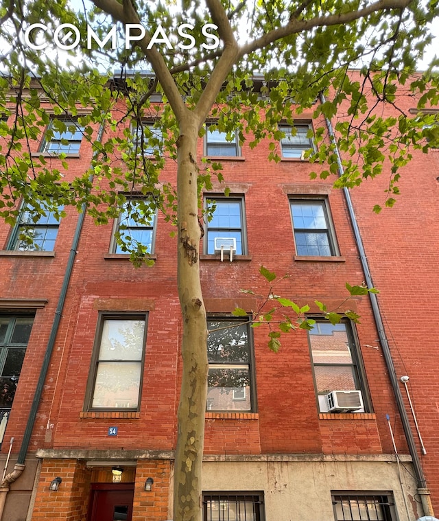 view of building exterior with cooling unit