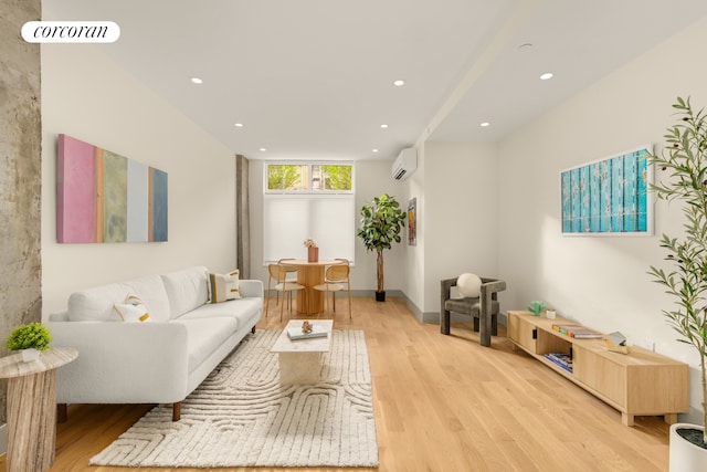 living room with a wall of windows, light wood-type flooring, and a wall mounted AC