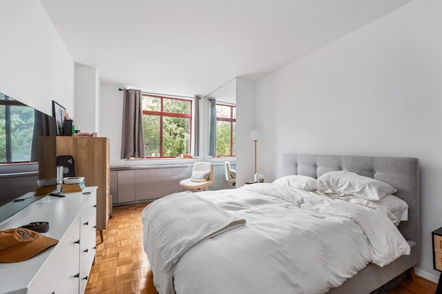 bedroom featuring light parquet floors