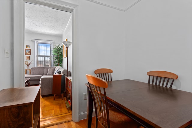 dining space with a textured ceiling