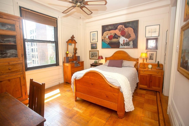 bedroom featuring light parquet flooring and ceiling fan