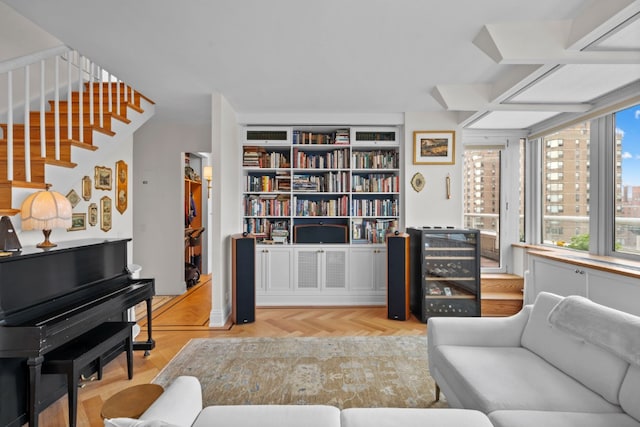 sitting room with wine cooler and light parquet flooring