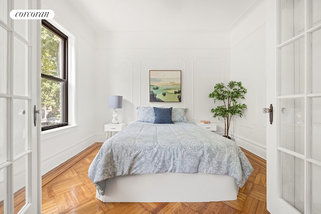 bedroom featuring parquet flooring