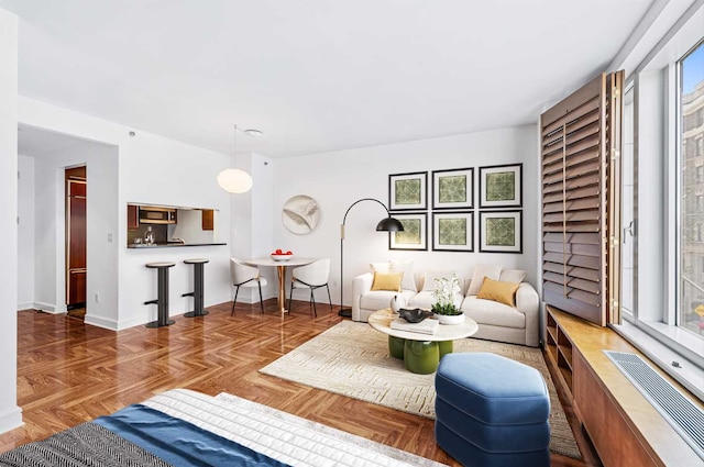 living room featuring parquet flooring