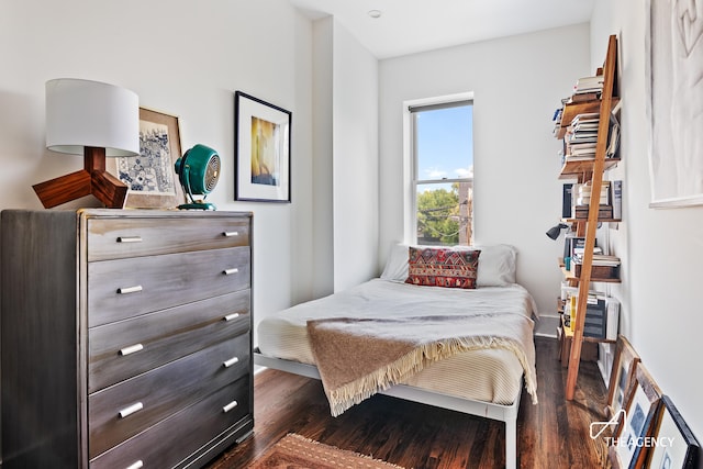 bedroom featuring dark wood-type flooring