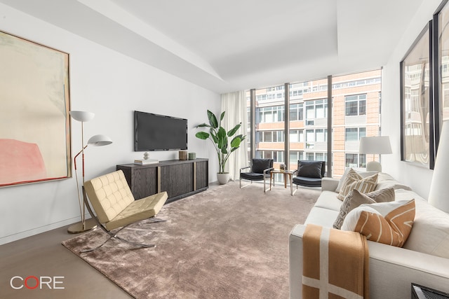 living room featuring floor to ceiling windows