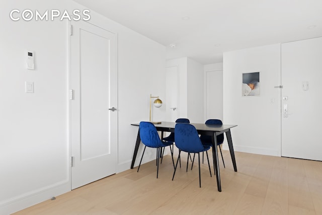 dining area featuring light wood-type flooring