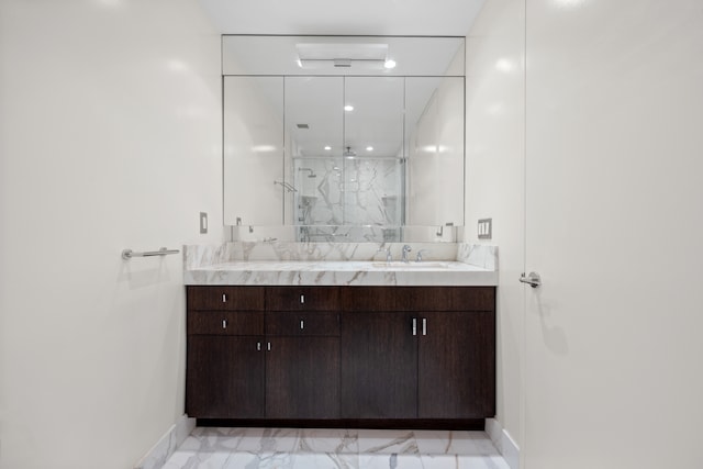 bathroom featuring vanity and a shower with shower door