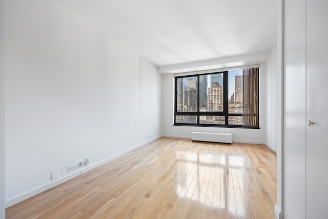 spare room with light wood-type flooring