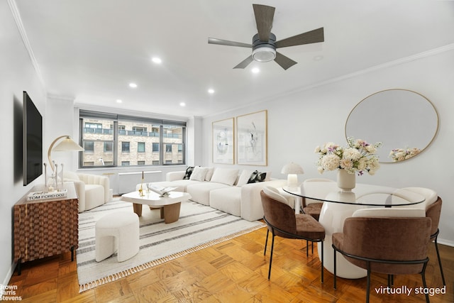 living room with ceiling fan, light parquet floors, and crown molding