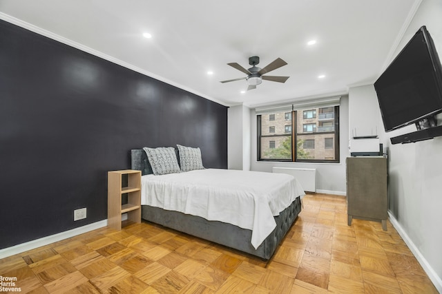 bedroom featuring parquet floors, ceiling fan, radiator heating unit, and crown molding