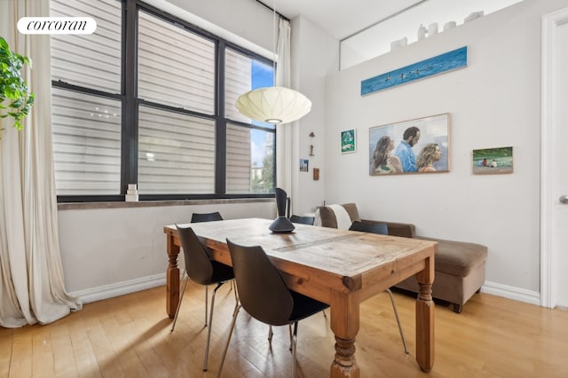 dining area with wood-type flooring