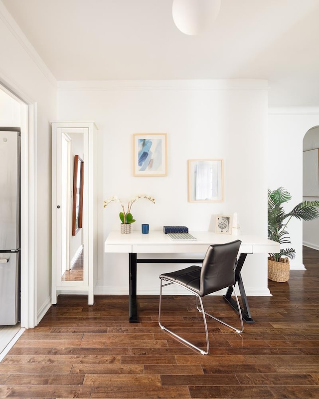 office area featuring dark hardwood / wood-style floors and crown molding