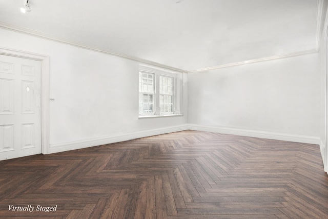 empty room with ornamental molding and dark parquet floors