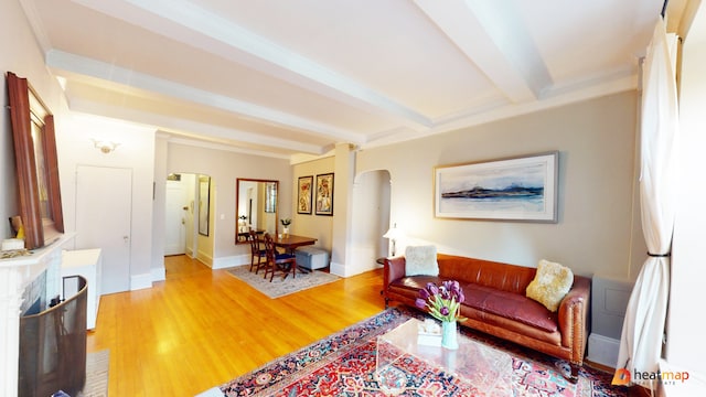 living room with beam ceiling and hardwood / wood-style flooring