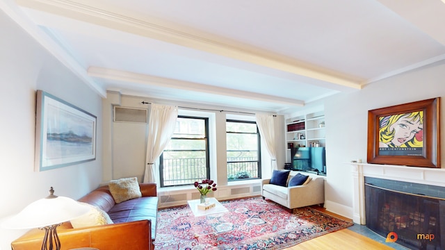 living room with beam ceiling, built in shelves, hardwood / wood-style floors, and crown molding