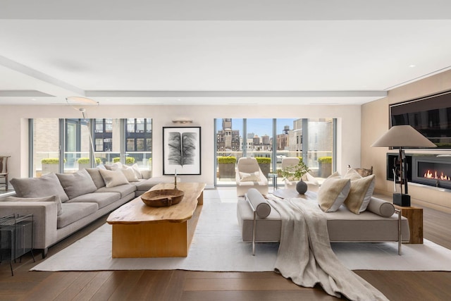 living room featuring a wealth of natural light and hardwood / wood-style floors