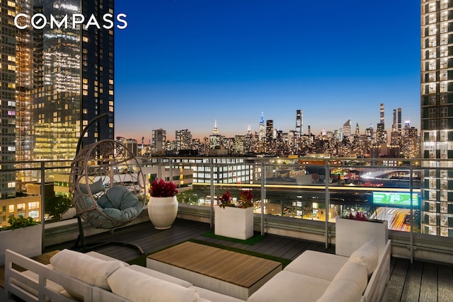 balcony at dusk with an outdoor living space