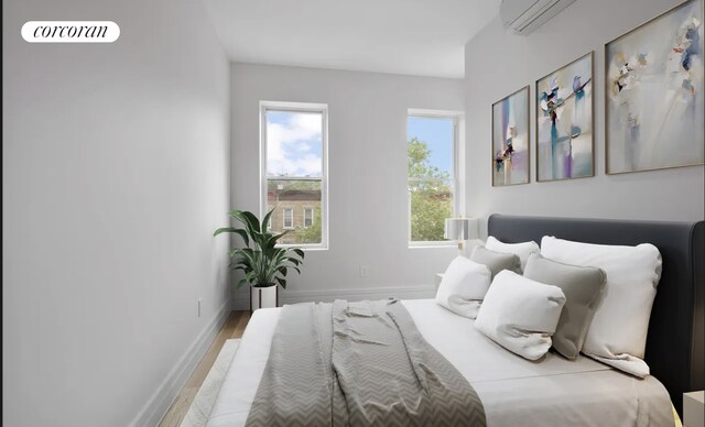 bedroom with hardwood / wood-style floors and multiple windows