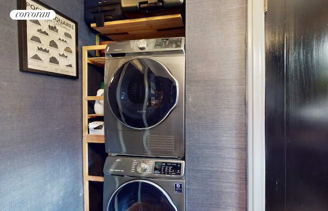 laundry room with stacked washer and dryer