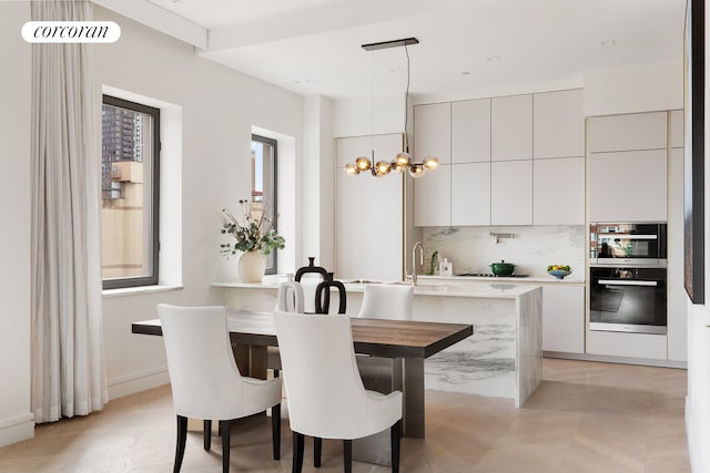 dining space featuring an inviting chandelier