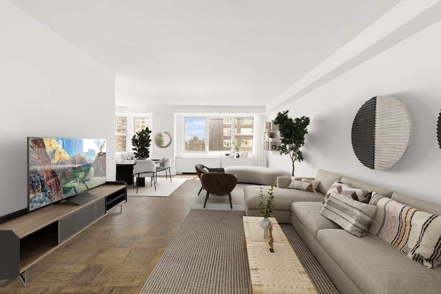 living room featuring dark parquet floors