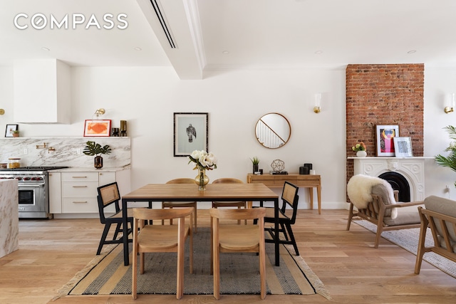 dining area with light wood-type flooring