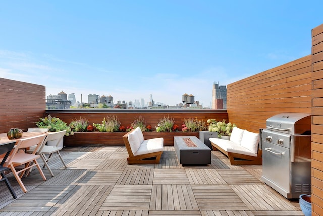 view of patio / terrace featuring a grill and an outdoor living space with a fire pit