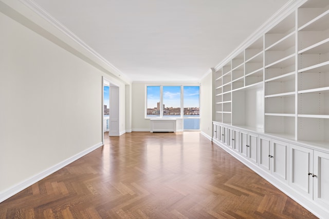 empty room with parquet floors and crown molding