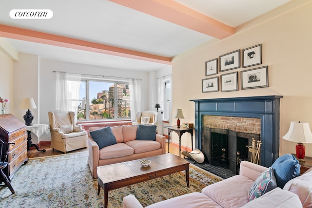 living room with wood-type flooring and a fireplace