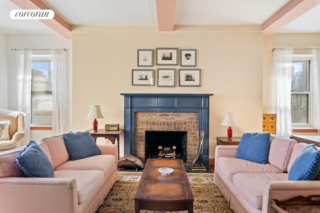 living room with beam ceiling and a fireplace