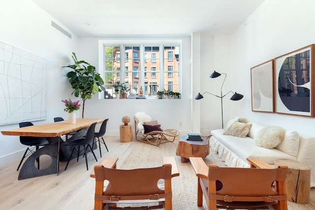 living area with light hardwood / wood-style flooring