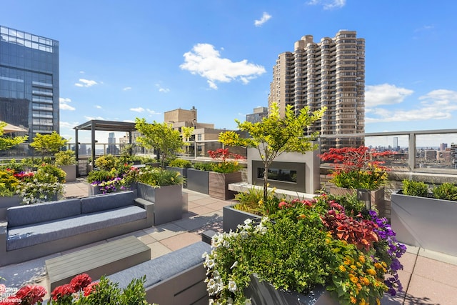 view of patio / terrace with a balcony and outdoor lounge area