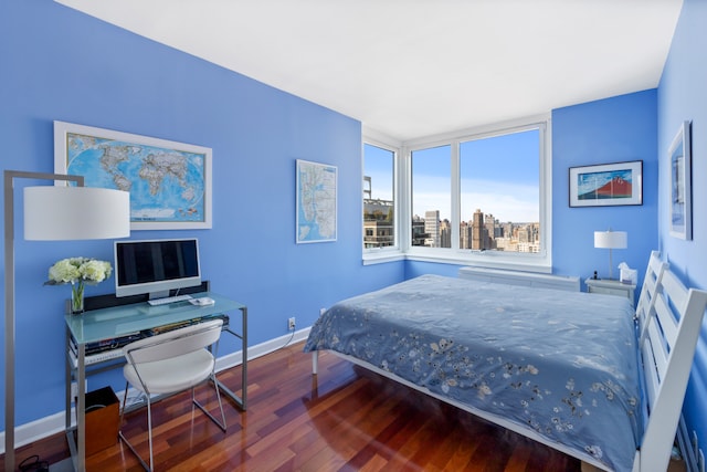 bedroom with hardwood / wood-style flooring