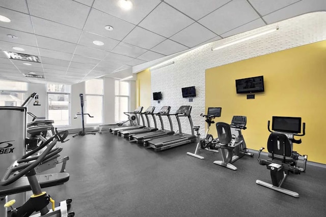 workout area featuring a paneled ceiling