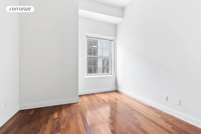 spare room featuring hardwood / wood-style floors