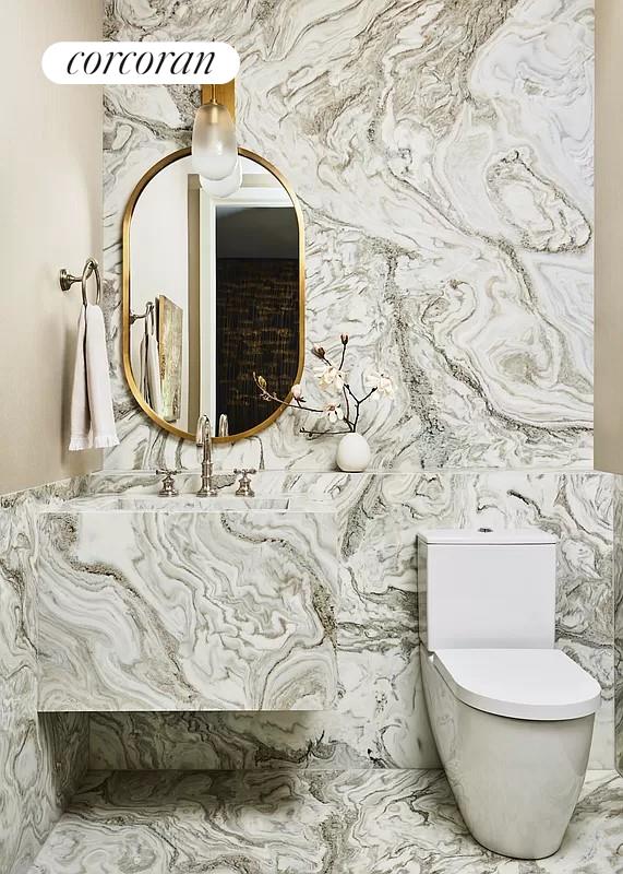 bathroom featuring tile walls, vanity, and toilet