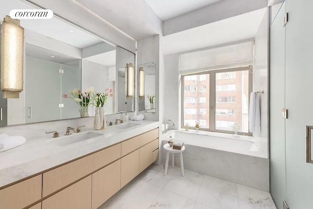 bathroom with a bath and vanity