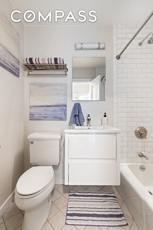 full bathroom with tile patterned flooring, vanity, toilet, and tiled shower / bath