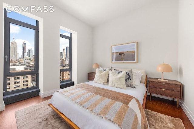 bedroom with hardwood / wood-style floors